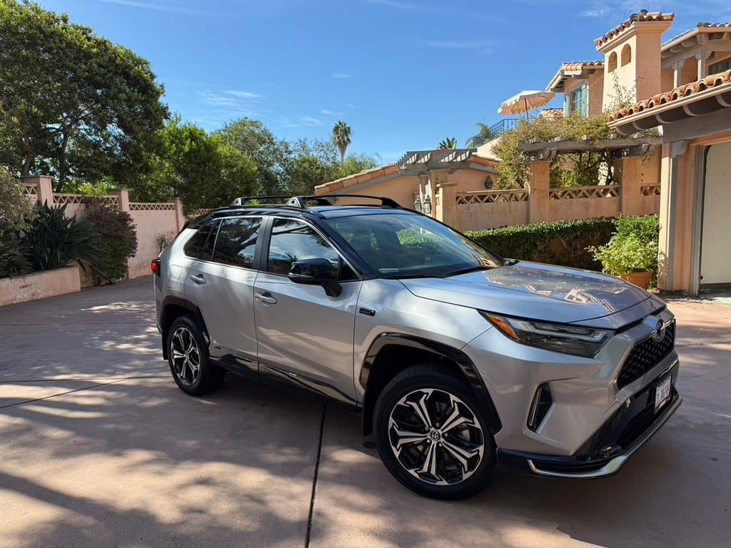Silver 2025 Toyota RAV4 in residential driveway