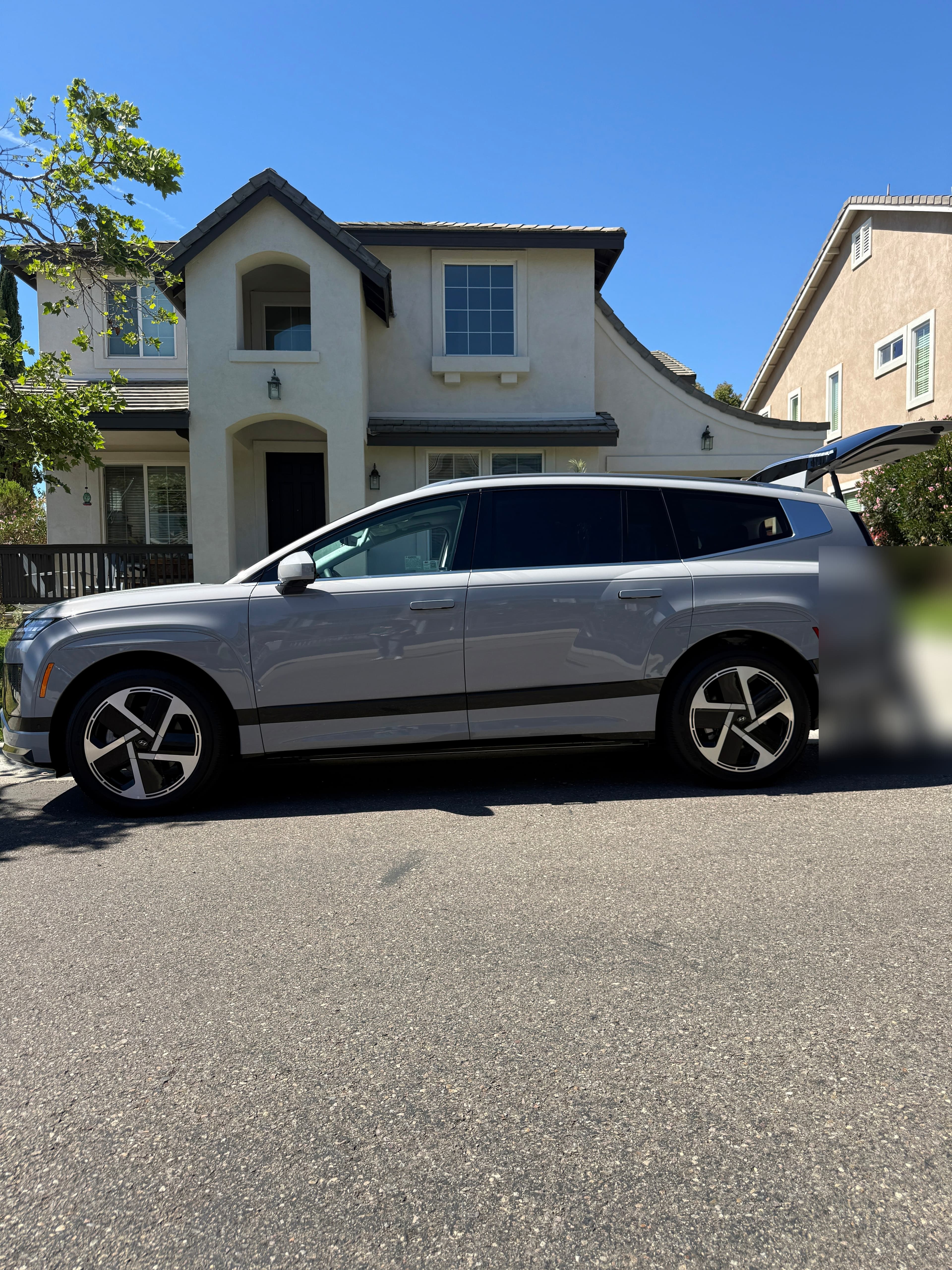 2026 silver Hyundai ioniq9 in front of residence